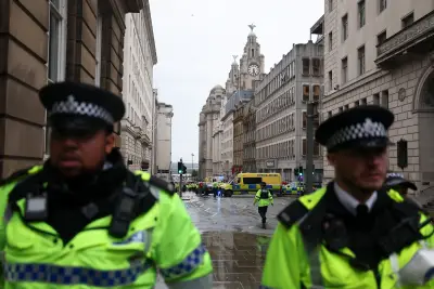 27 hospitalized, including 4 children, after car plows into Liverpool FC parade